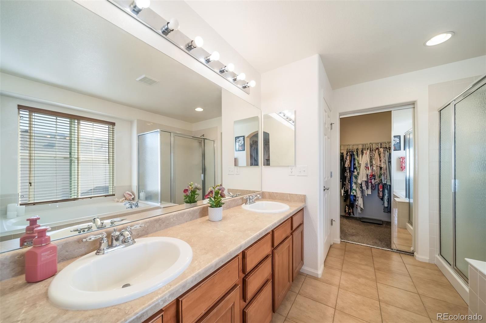3041 South Jericho Way Aurora, CO 80013 - Photo 29 of 46 a bathroom with a sink double vanity