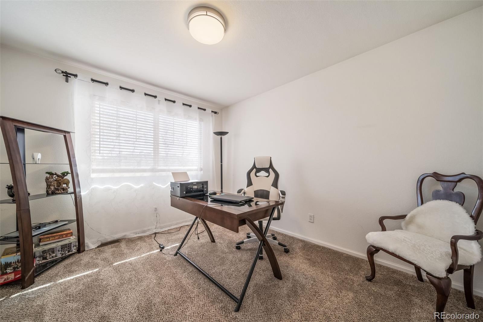 3041 South Jericho Way Aurora, CO 80013 - Photo 32 of 46 a view of a workspace with furniture