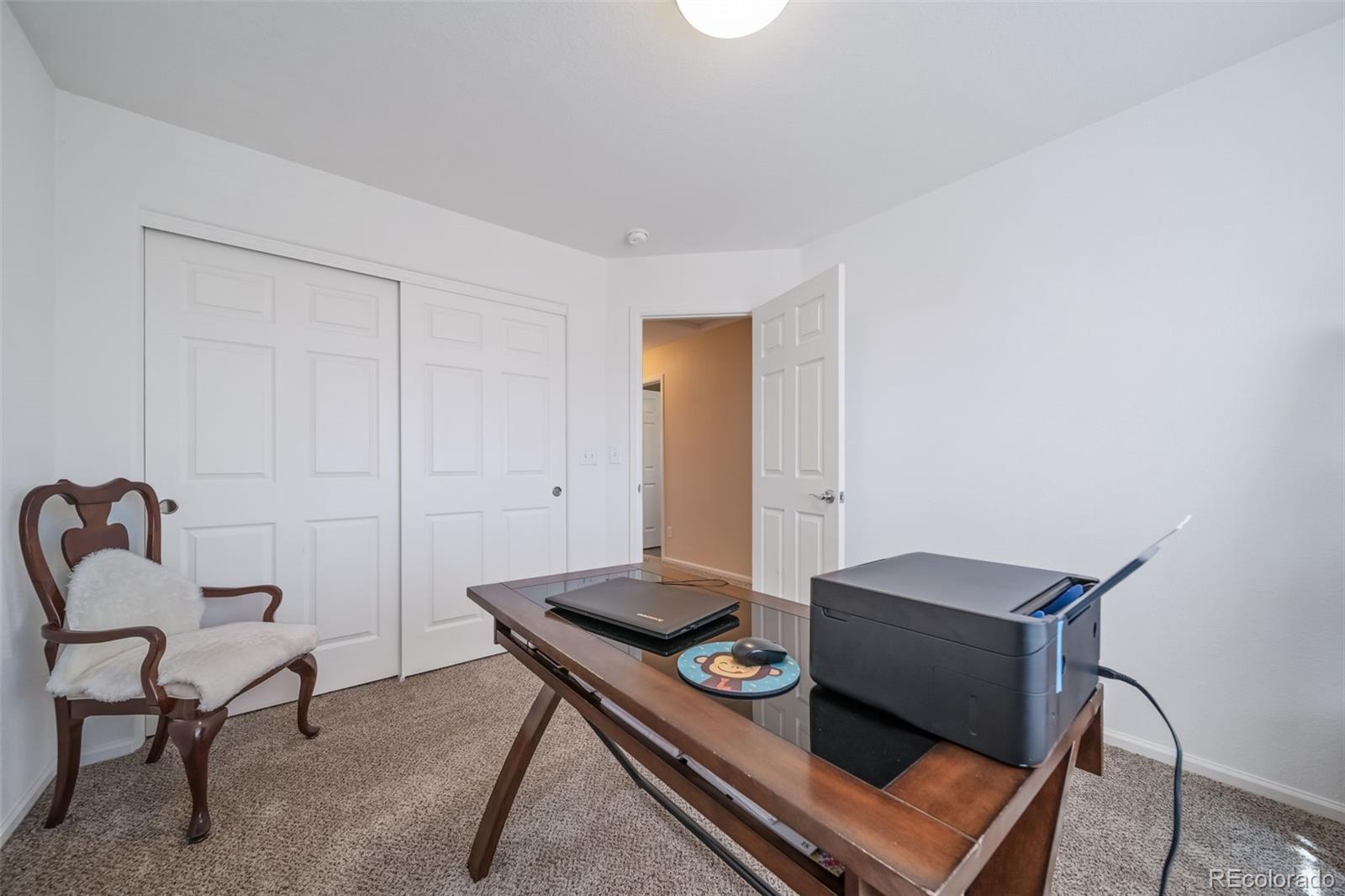 3041 South Jericho Way Aurora, CO 80013 - Photo 33 of 46 a living room with furniture