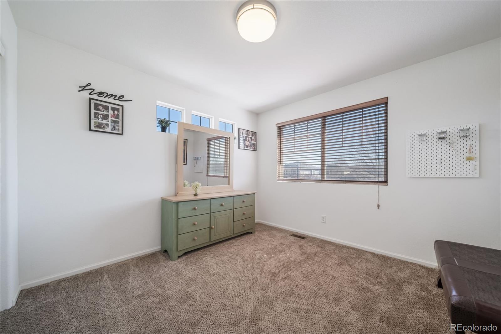 3041 South Jericho Way Aurora, CO 80013 - Photo 35 of 46 a room with painting and a window