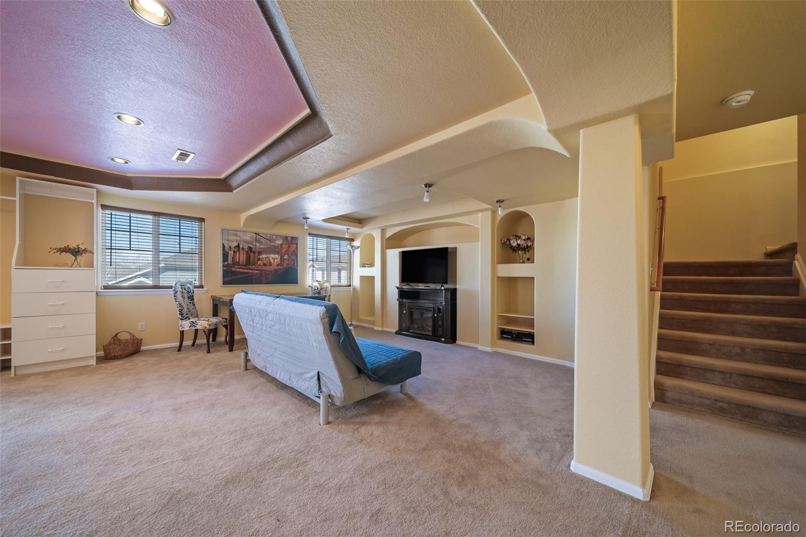 3041 South Jericho Way Aurora, CO 80013 - Photo 36 of 46 a view of a livingroom with furniture and windows