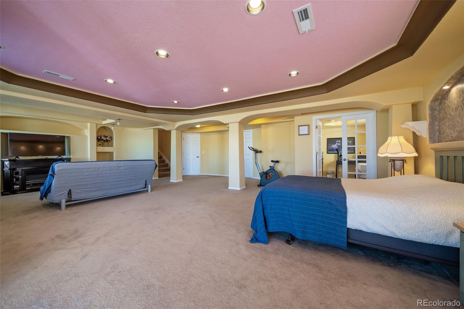 3041 South Jericho Way Aurora, CO 80013 - Photo 39 of 46 a spacious bedroom with a bed and dresser