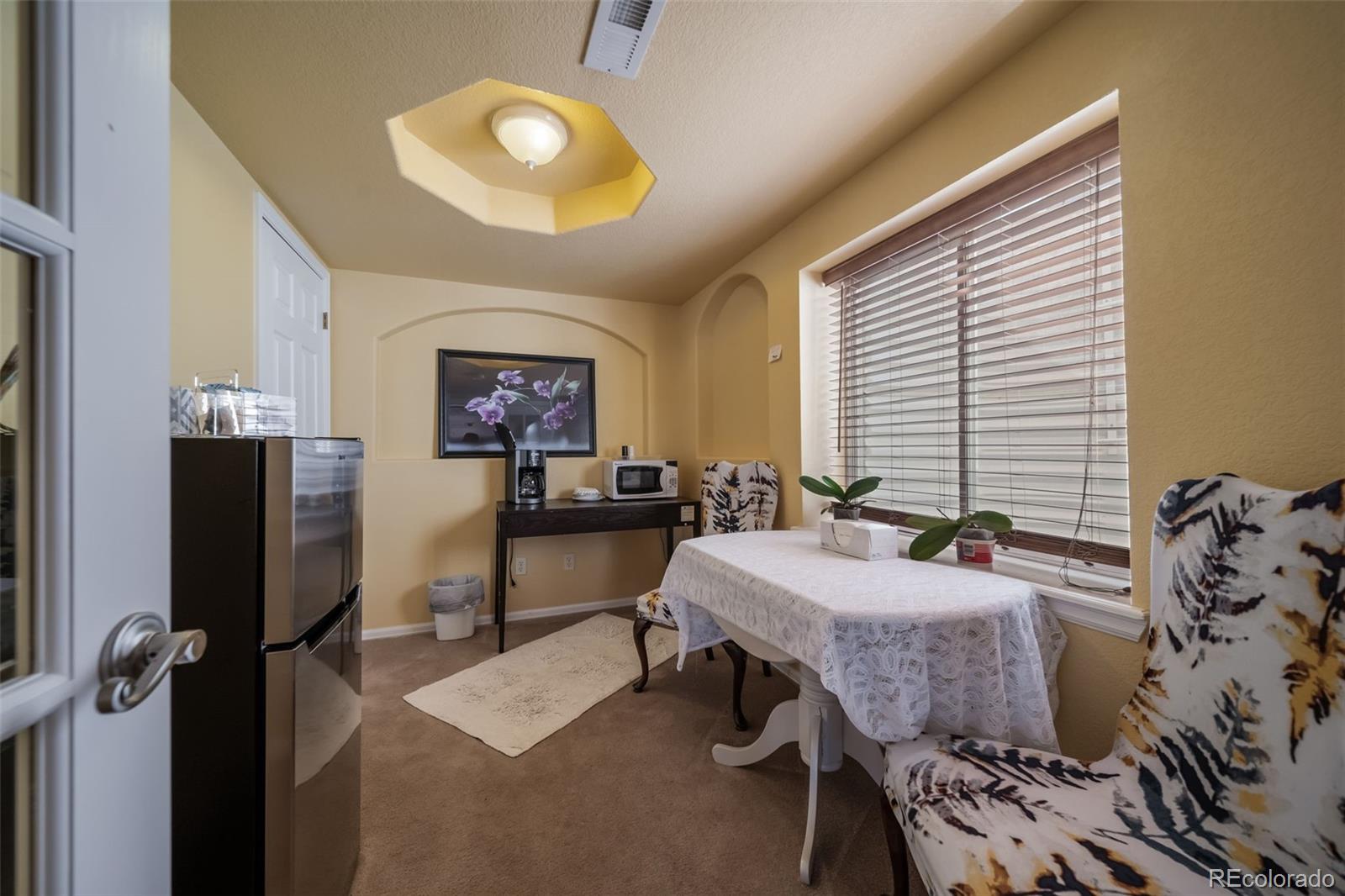3041 South Jericho Way Aurora, CO 80013 - Photo 40 of 46 a view of a livingroom with furniture and window