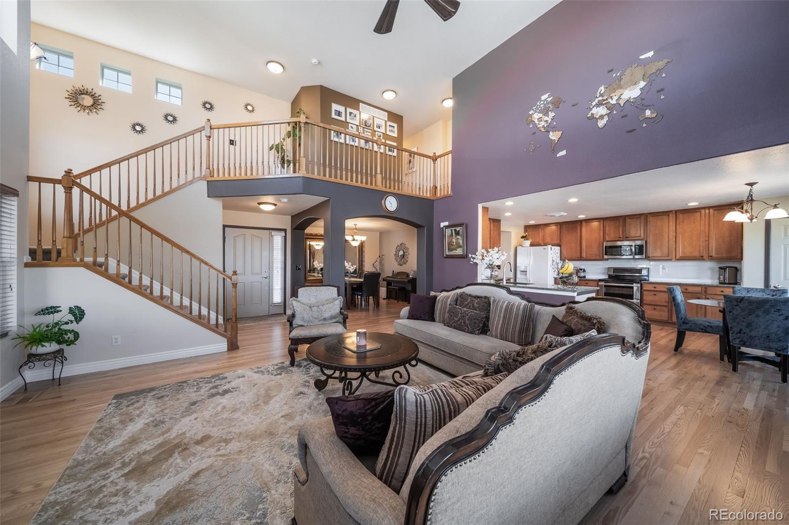 3041 South Jericho Way Aurora, CO 80013 - Photo 10 of 46 a living room with furniture kitchen view and a chandelier