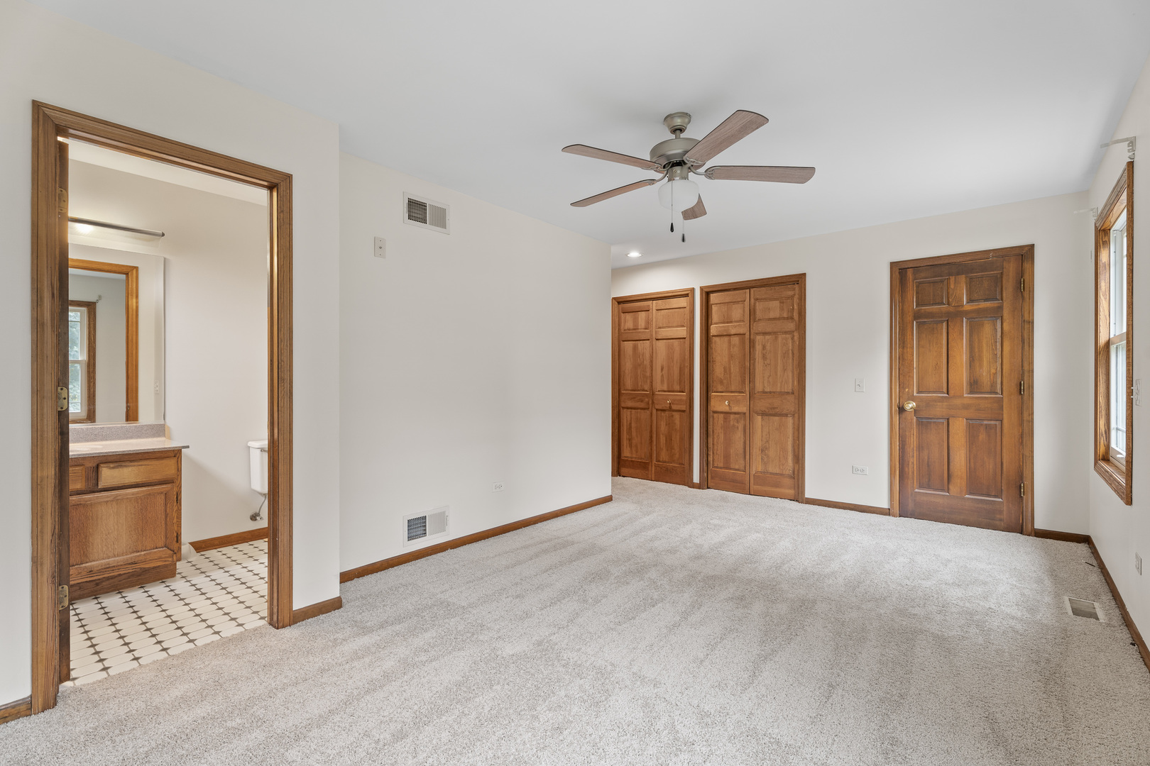 1914 Spring Dale Drive Spring Grove, IL 60081 - Photo 12 of 27 a view of empty room with wooden floor and fan