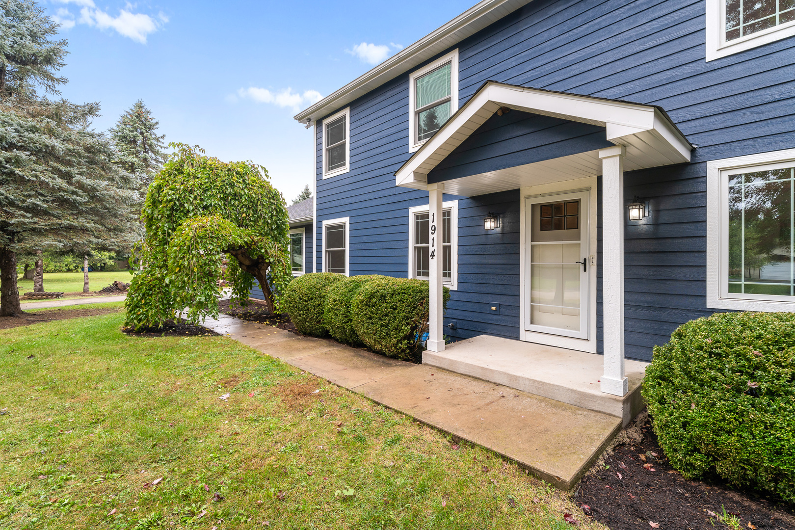 1914 Spring Dale Drive Spring Grove, IL 60081 - Photo 2 of 27 a view of a house with a yard and plants