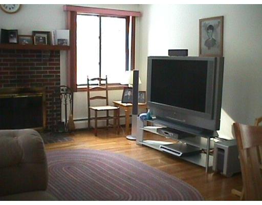 18 Cooper Pond Road Rowley, MA 01969 - Photo 4 of 8 a living room with furniture and a flat screen tv