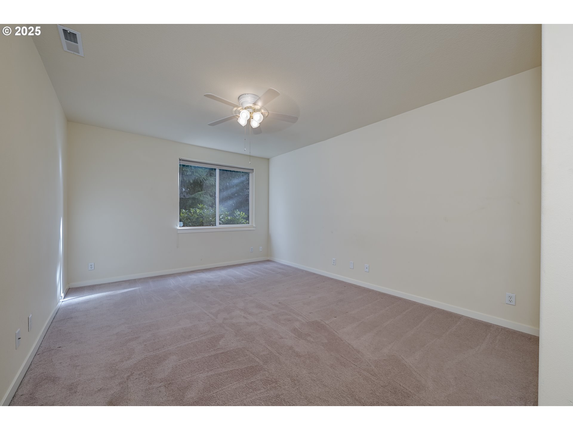384 Southwest 105th Terrace Portland, OR 97225 - Photo 17 of 30 a view of an empty room with a window