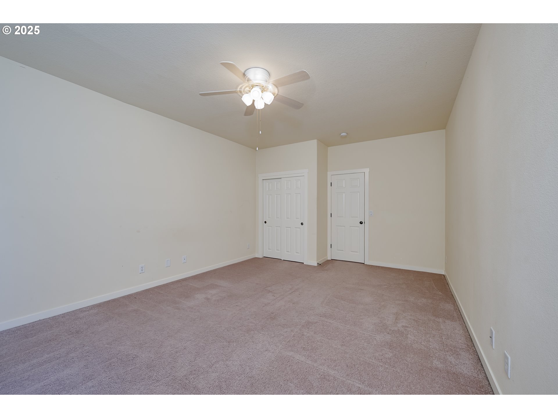 384 Southwest 105th Terrace Portland, OR 97225 - Photo 20 of 30 a view of an empty room with a chandelier fan