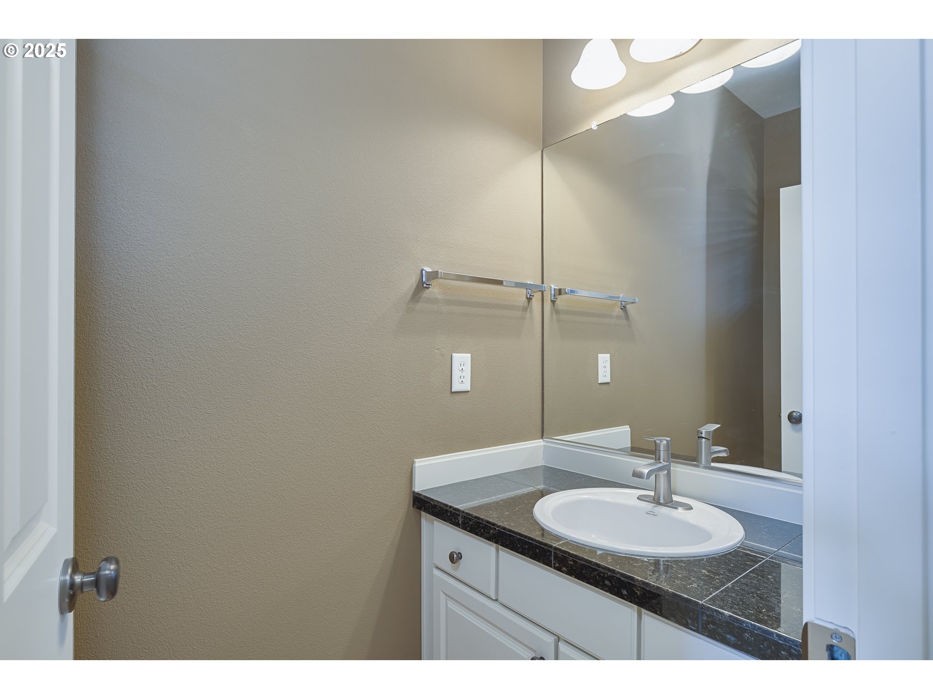 384 Southwest 105th Terrace Portland, OR 97225 - Photo 23 of 30 a bathroom with a granite countertop sink and a mirror