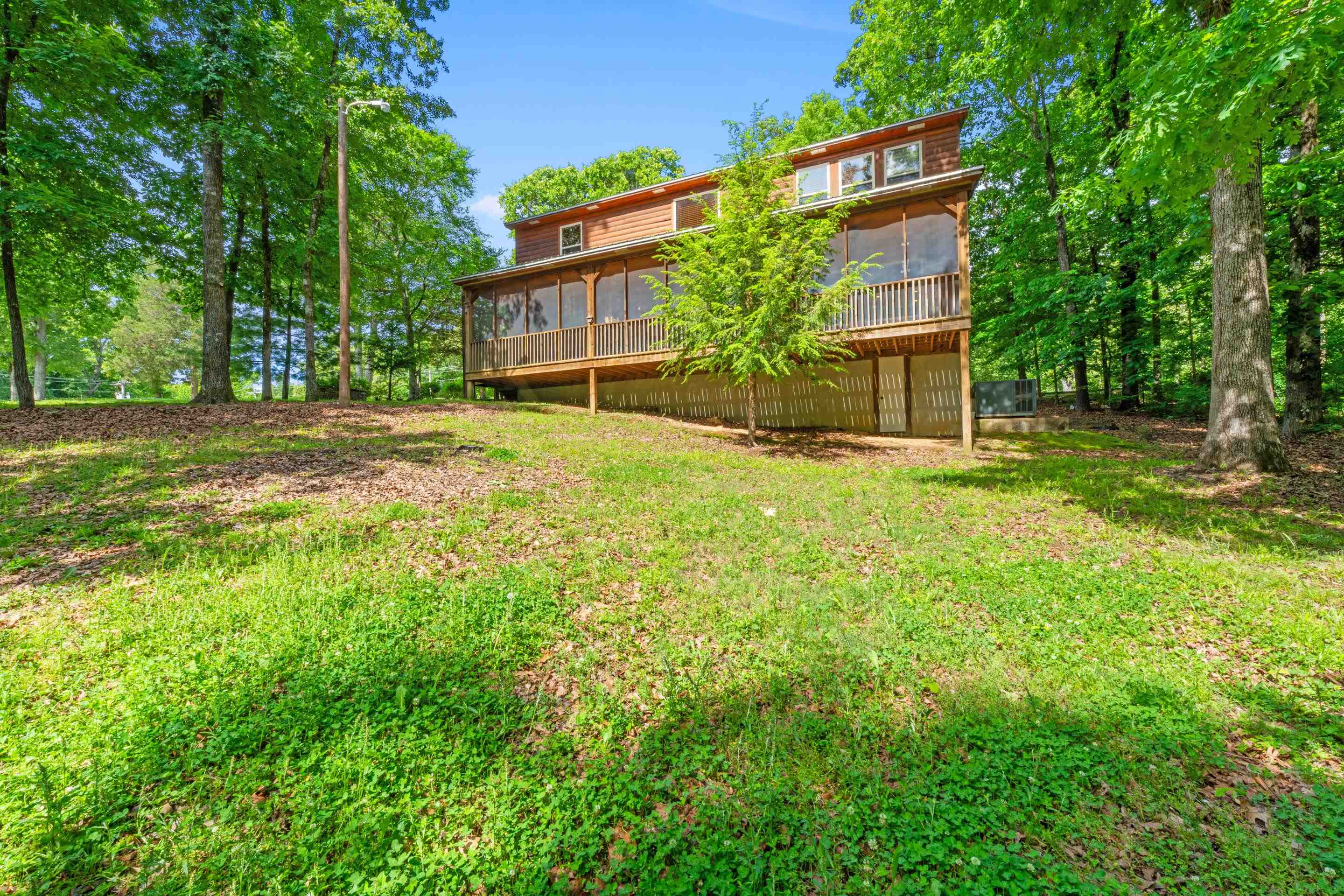 950 Cherry Road Eads, TN 38028 - Photo 27 of 30 Two-story residence featuring a screened-in porch with wood railing and slatted wood privacy screening