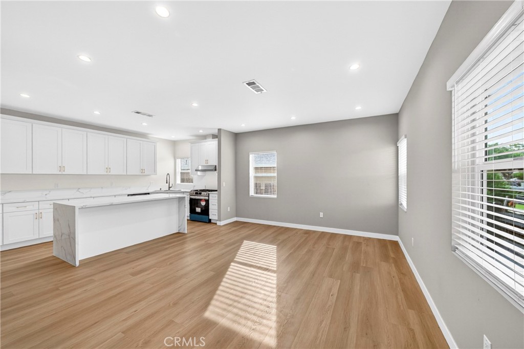 2643 Tenth Street Riverside, CA 92507 - Photo 4 of 40 a view of a kitchen with wooden floor and electronic appliances