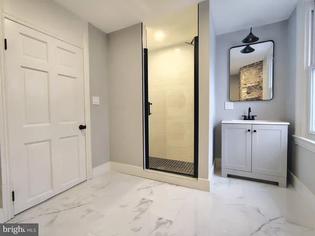 a view of a bathroom from the hallway