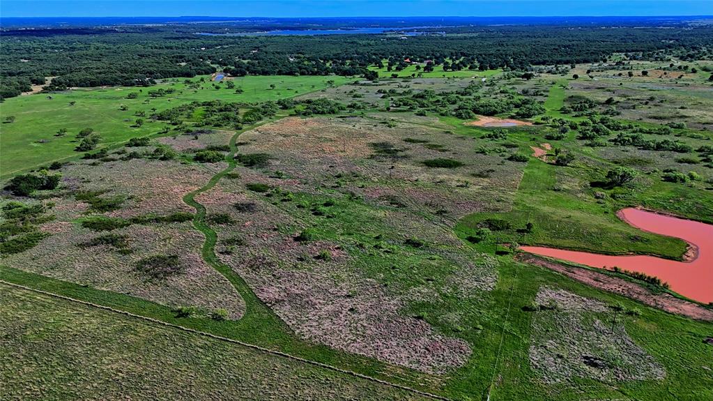 0 Carpenter Road Nocona, TX 76255 - Photo 23 of 29 a view of a lush green outdoor space with a swimming pool