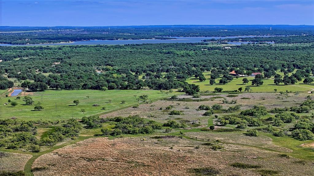 0 Carpenter Road Nocona, TX 76255 - Photo 28 of 29 a view of a field with a house in the background