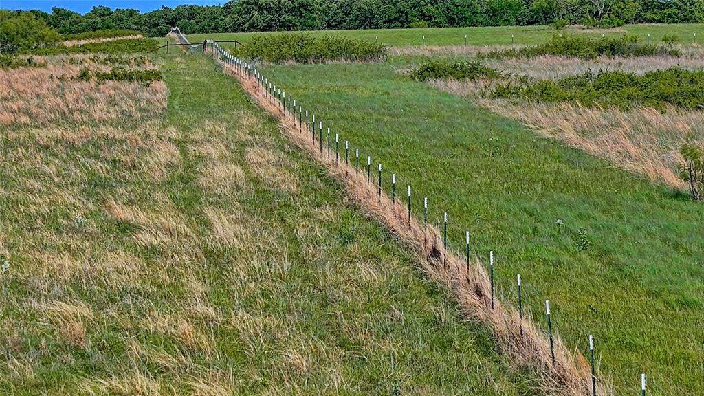 0 Carpenter Road Nocona, TX 76255 - Photo 5 of 29 a view of a lake with a yard and large trees