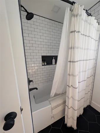 a bathroom with a sink and a shower