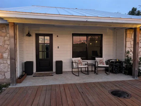 a view of a dinning room with wooden floor and furniture