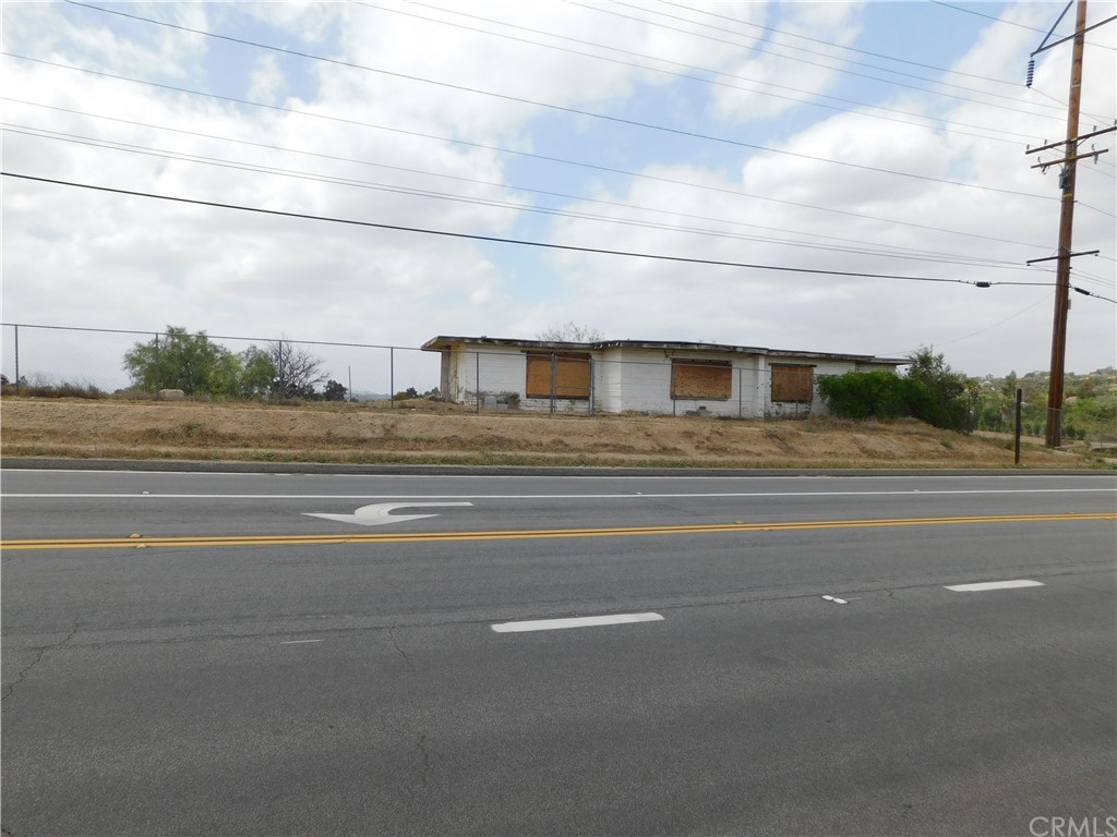 a view of a street with a building in the background