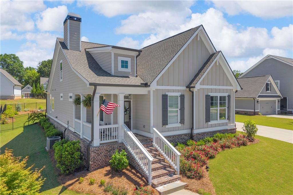 943 Clubside Drive Monroe, GA 30655 - Photo 1 of 24 a front view of house with yard