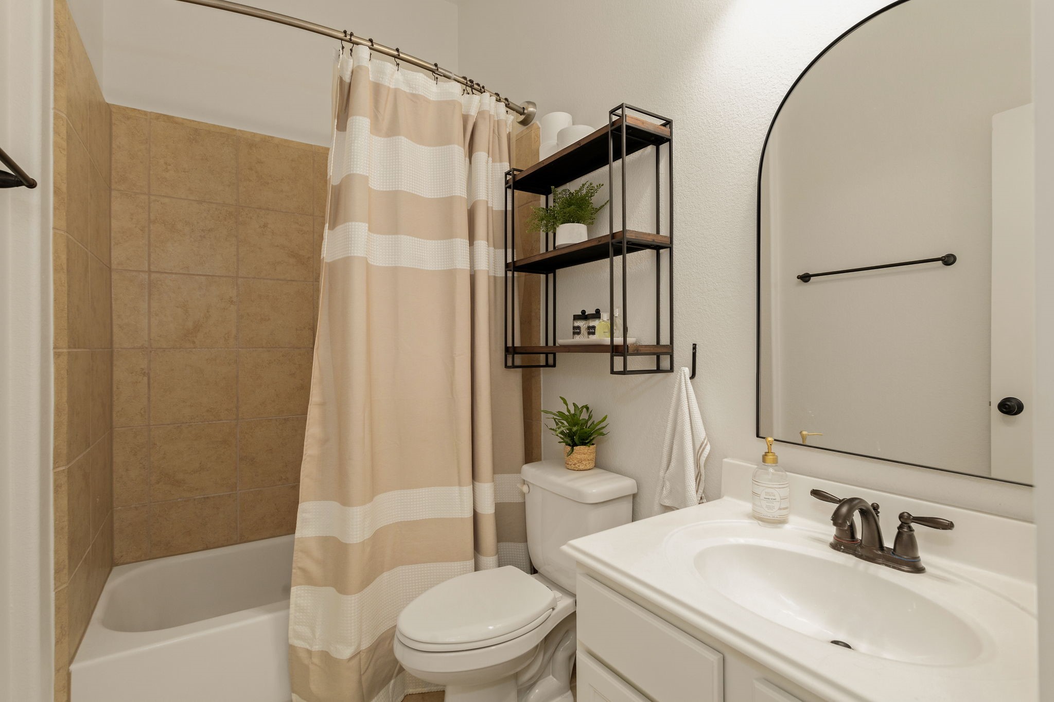 16650 Seminole Ridge Drive Cypress, TX 77433 - Photo 19 of 27 a bathroom with a sink toilet and shower
