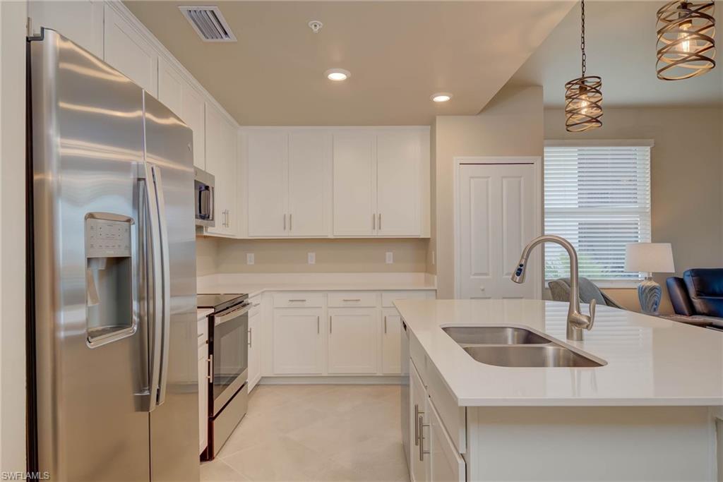 5715 Double Eagle Circle, Unit 4421 Immokalee, FL 34142 - Photo 7 of 31 Kitchen with island