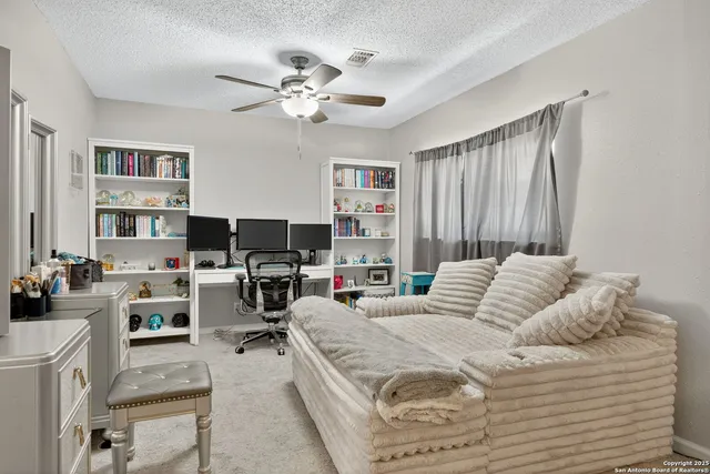 a bedroom with a bed furniture and a chandelier