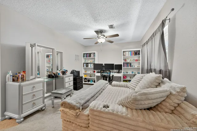 a bed room with a bed window and a couch