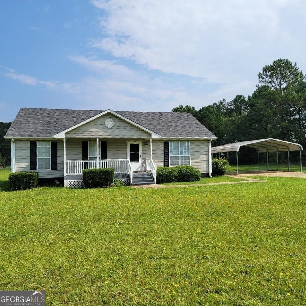 1097 Brittany Road Stapleton, GA 30823 - Photo 1 of 1 a front view of a house with a garden