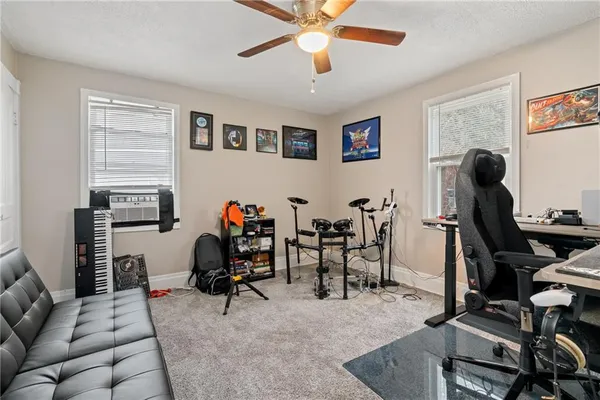 a view of a workspace with furniture and a livingroom