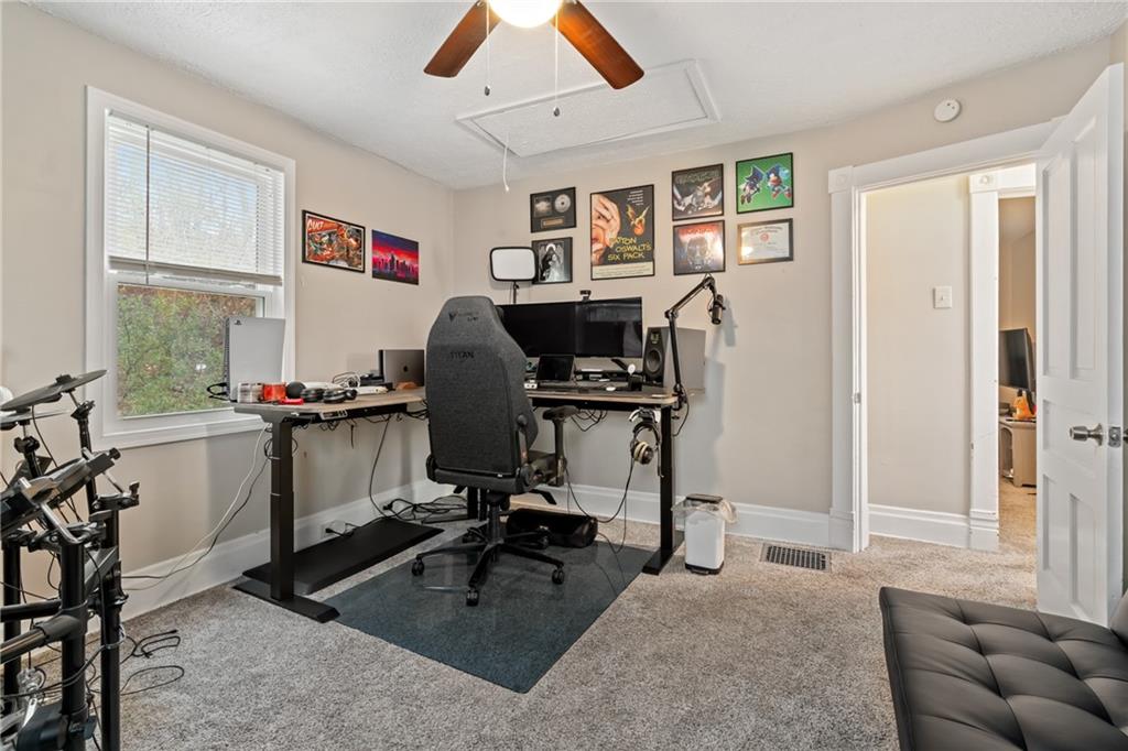 821 George Street Coraopolis, PA 15108 - Photo 12 of 18 a view of a workspace with furniture and a window