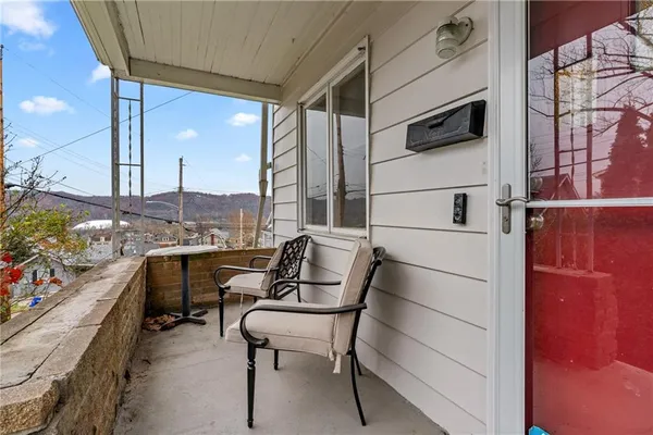 a view of balcony with furniture