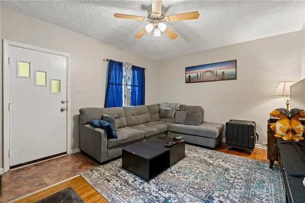 a living room with furniture and a rug