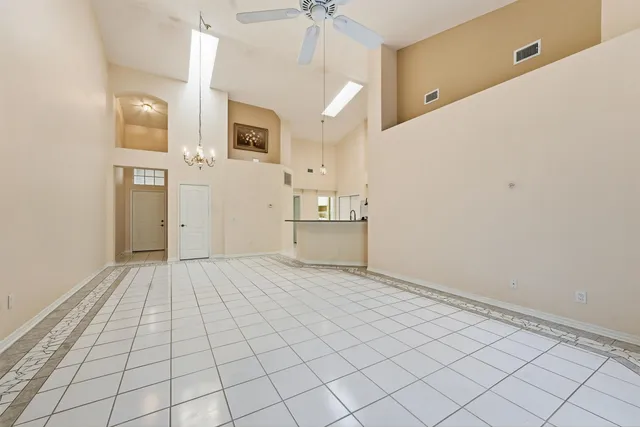 a kitchen with a refrigerator a microwave and cabinets