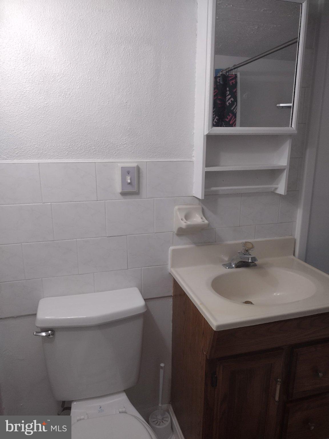 6802 Killarney Street Clinton, MD 20735 - Photo 11 of 19 a bathroom with a sink and a toilet
