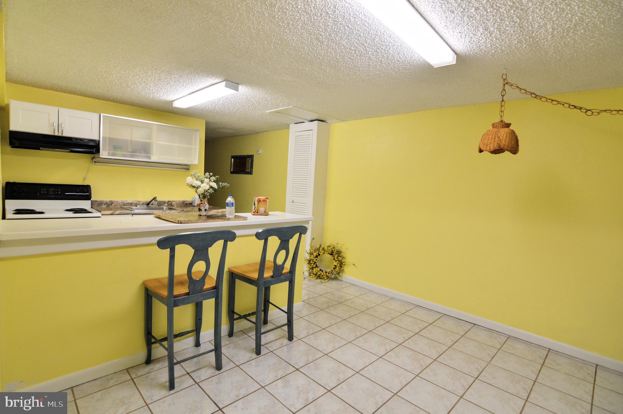 6802 Killarney Street Clinton, MD 20735 - Photo 5 of 19 a kitchen with a sink and cabinets