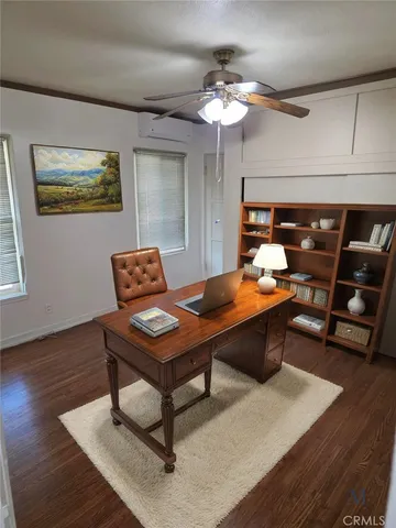 a room with furniture pool table and wooden floor