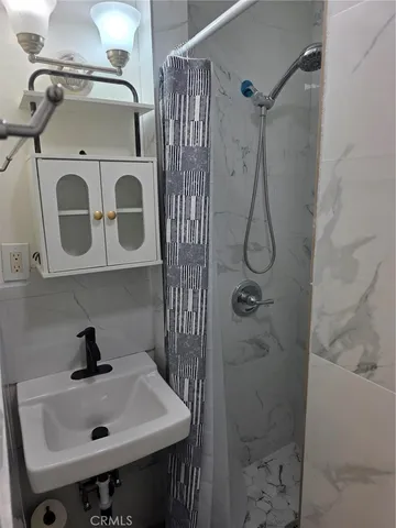 a bathroom with a sink and mirror