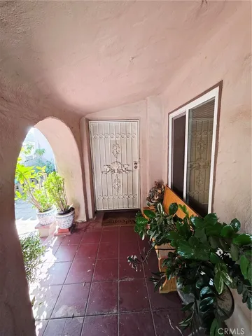 a view of a entryway with flower pots