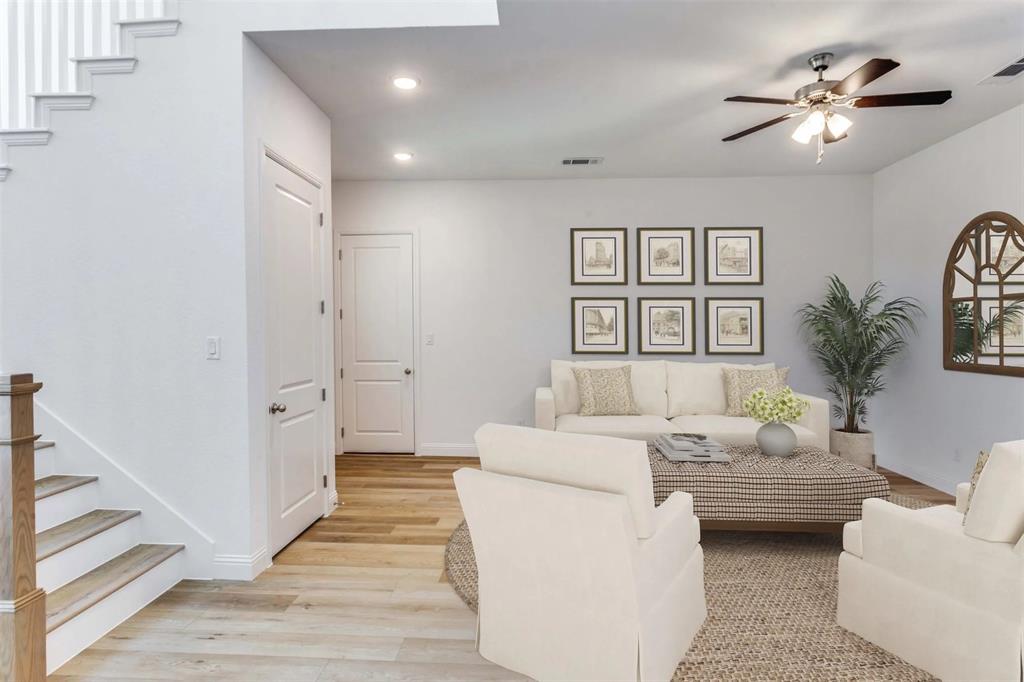 8965 Armstrong Court Benbrook, TX 76126 - Photo 14 of 24 a living room with furniture and a chandelier