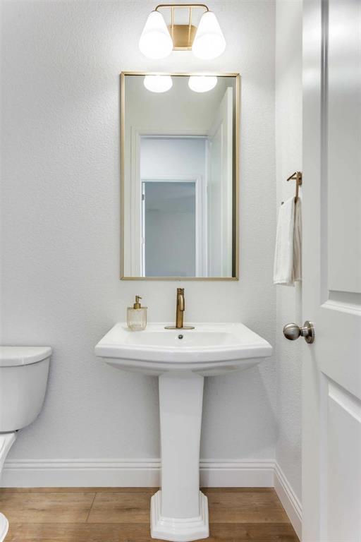8965 Armstrong Court Benbrook, TX 76126 - Photo 16 of 24 a bathroom with a sink and a mirror