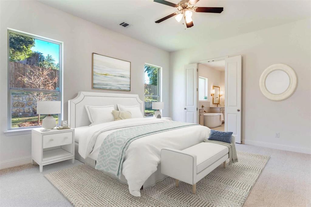 8965 Armstrong Court Benbrook, TX 76126 - Photo 17 of 24 a bedroom with a large bed and a chandelier