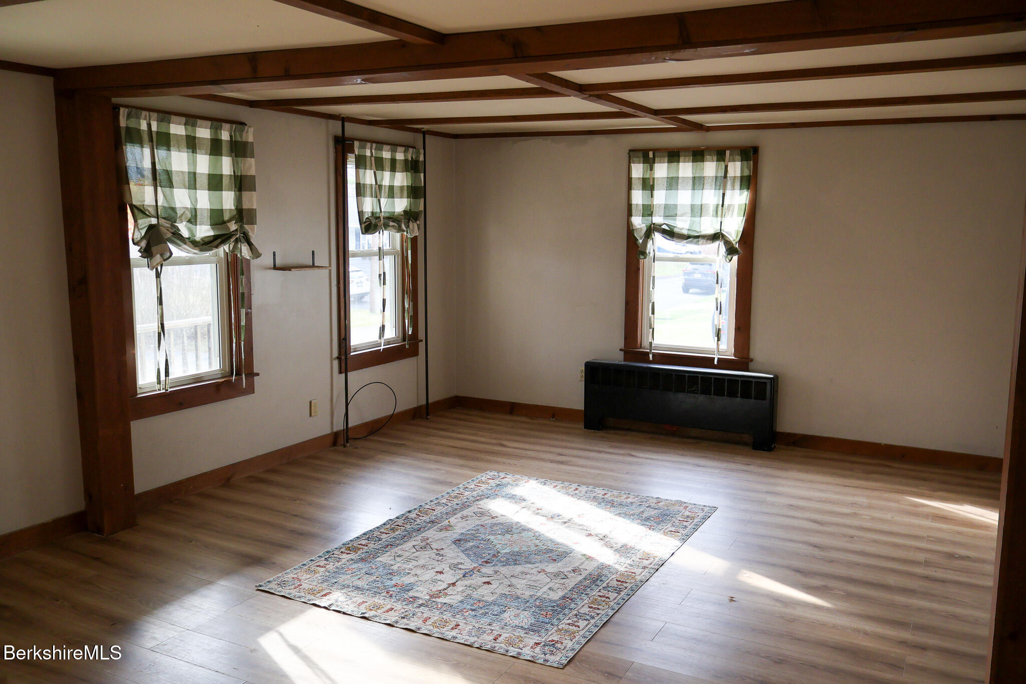 9 Beecher Street Adams, MA 01220 - Photo 12 of 23 an empty room with wooden floor and windows