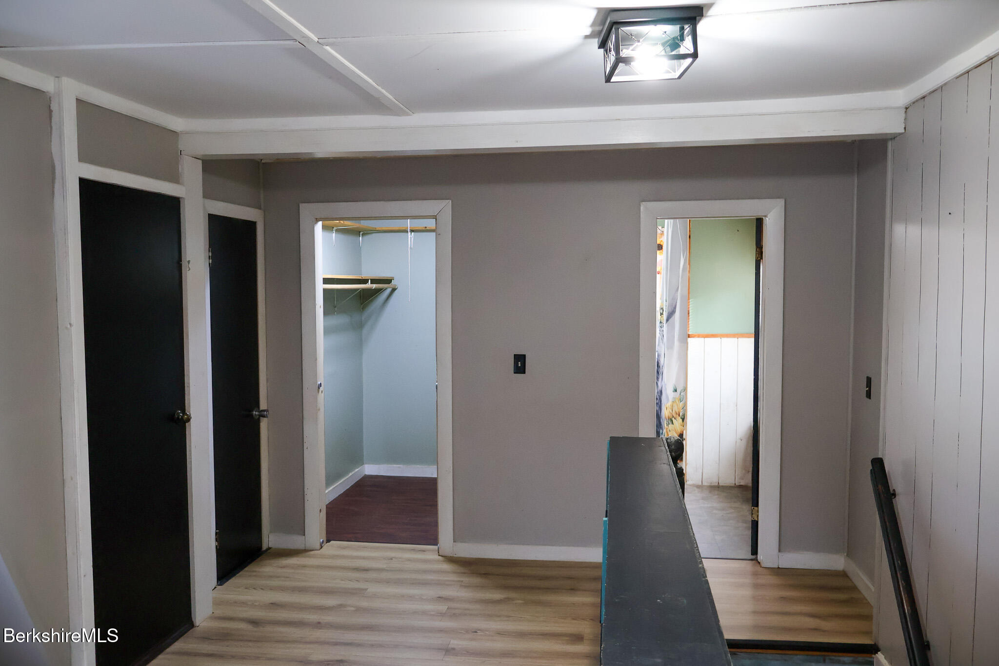 9 Beecher Street Adams, MA 01220 - Photo 17 of 23 a view of a hallway with wooden floor and staircase