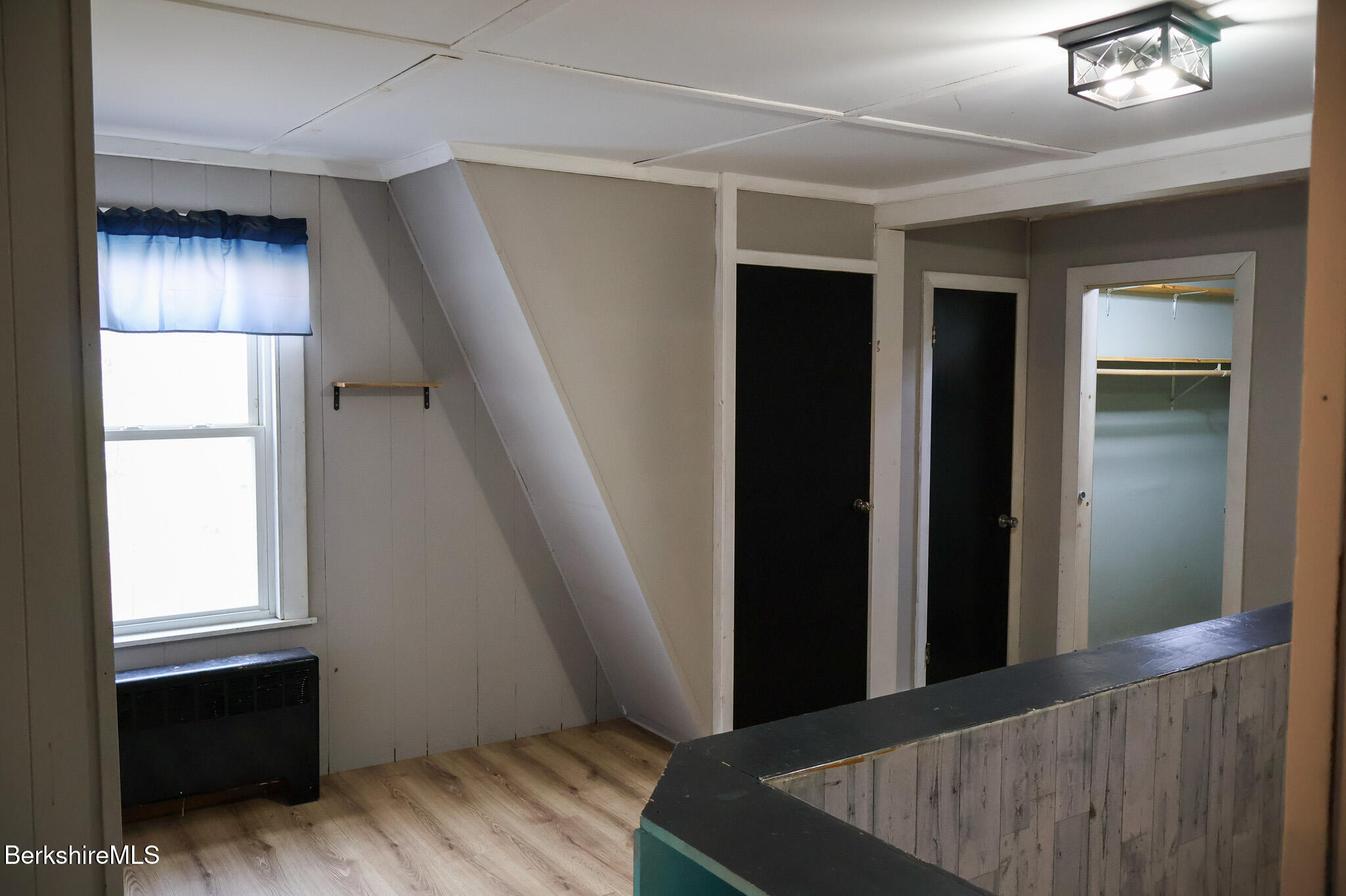 9 Beecher Street Adams, MA 01220 - Photo 18 of 23 wooden floor in an empty room with a window