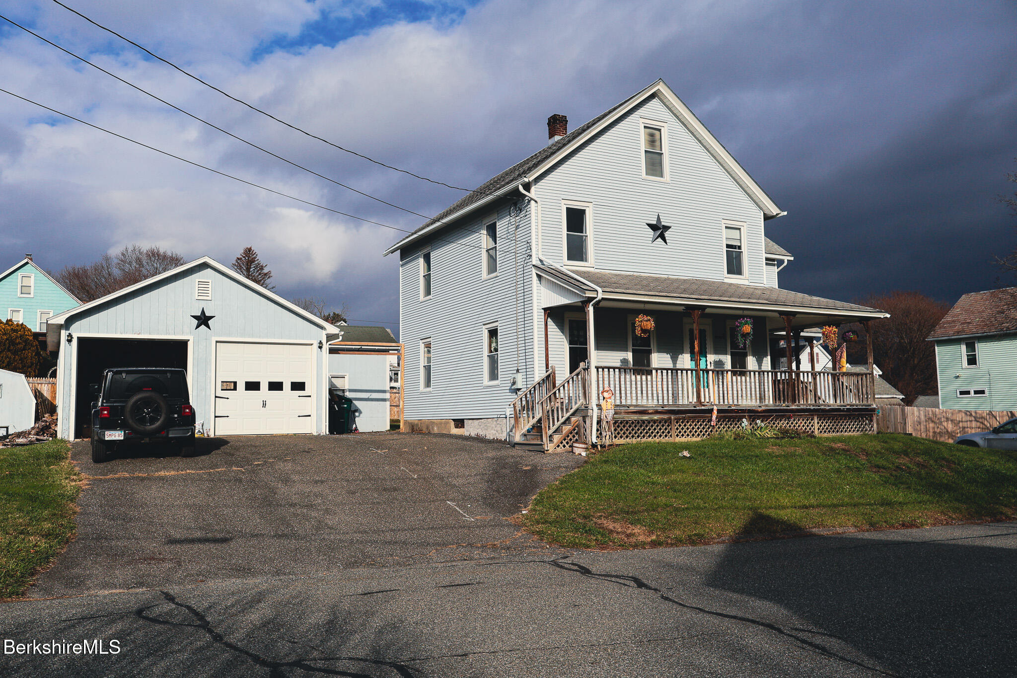 9 Beecher Street Adams, MA 01220 - Photo 2 of 23 a view of white house with a yard and porch