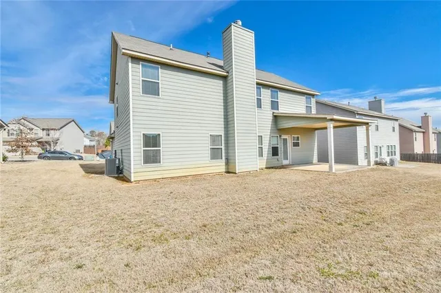 a house with yard in front of it