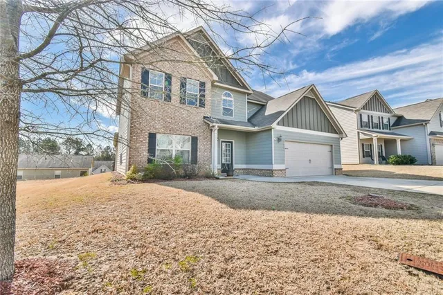 a front view of a house with a yard