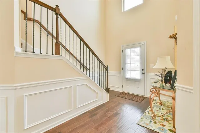 a view of an entryway with wooden floor
