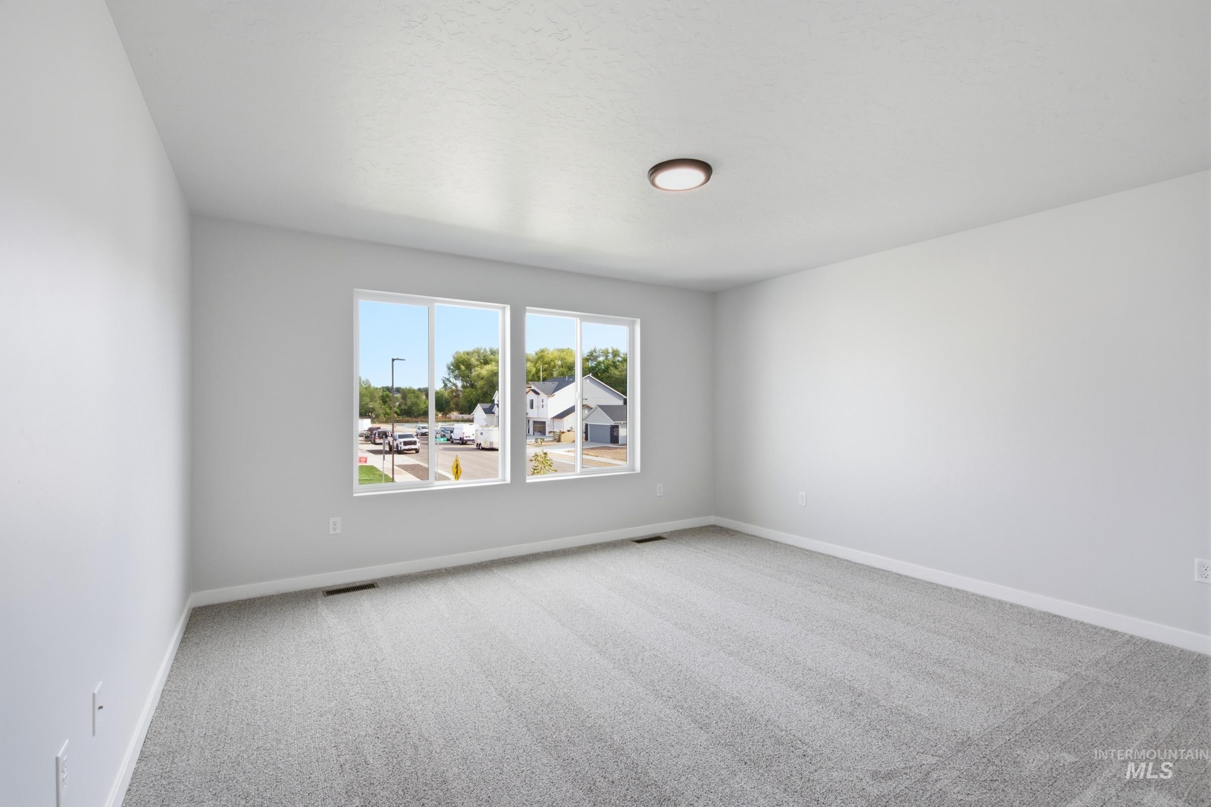 13324 Bank Street Caldwell, ID 83607 - Photo 25 of 29 Light gray carpeting and white walls